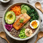 Healthy Salmon Buddha Bowl with quinoa and fresh vegetables